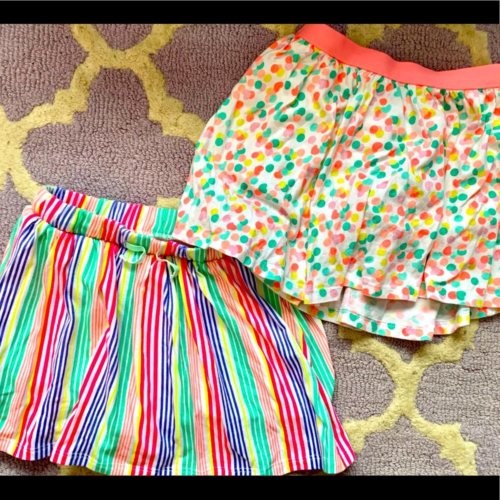 2 pairs girls skirts with shorts sewn in.
